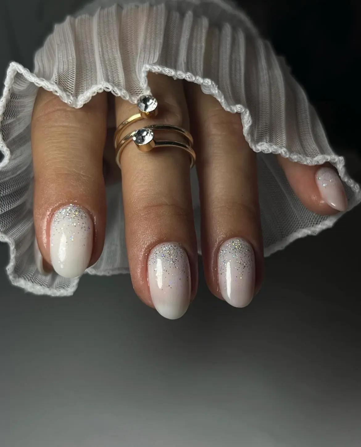 Milky white ombré manicure with a soft shimmer