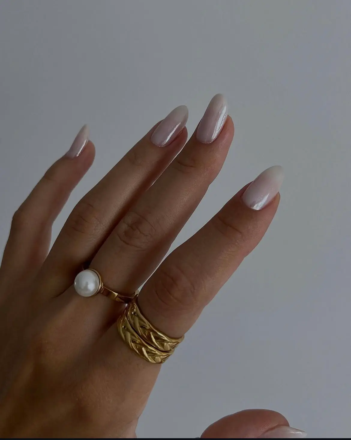 Pearl French almond nails with a soft luminous finish